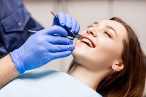 an image of a woman getting dental implants.