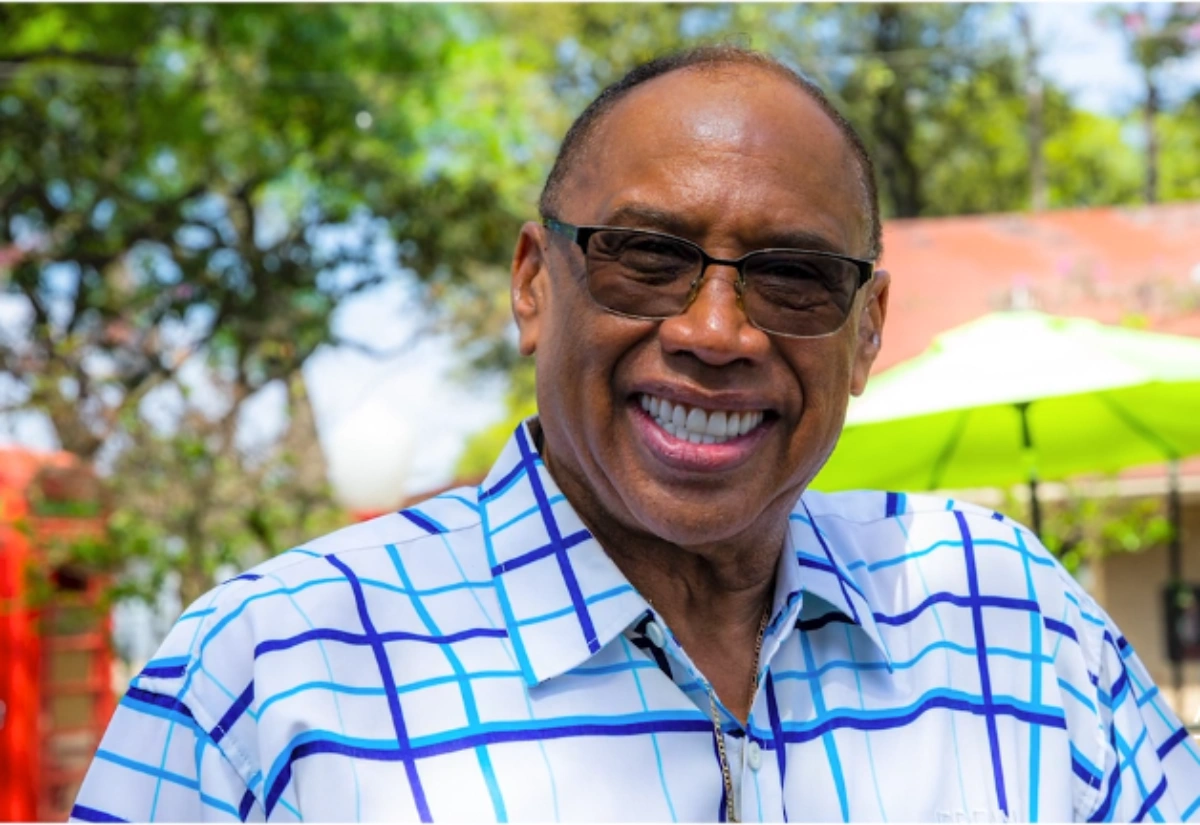 Amazing Dental Solutions patient smiling confidently after exploring dentures and implant options.