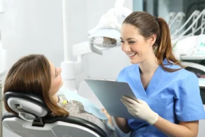 Young adult discussing wisdom tooth concerns with a dental professional during a consultation.